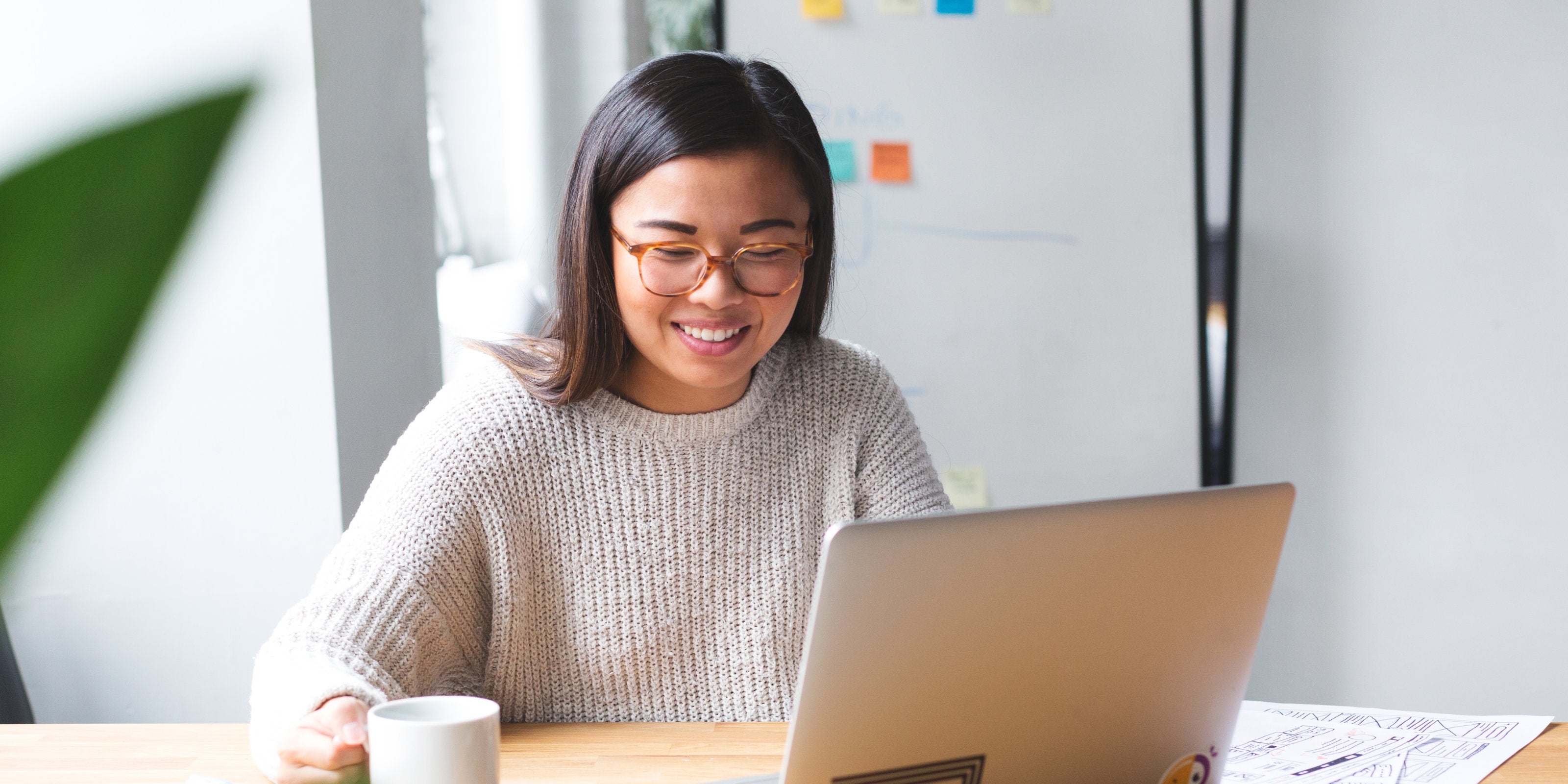 Happy woman at her computer