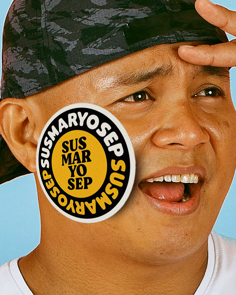 man with sticker on his cheek