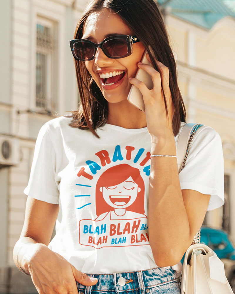 Happy woman on cellphone wearing t-shirt